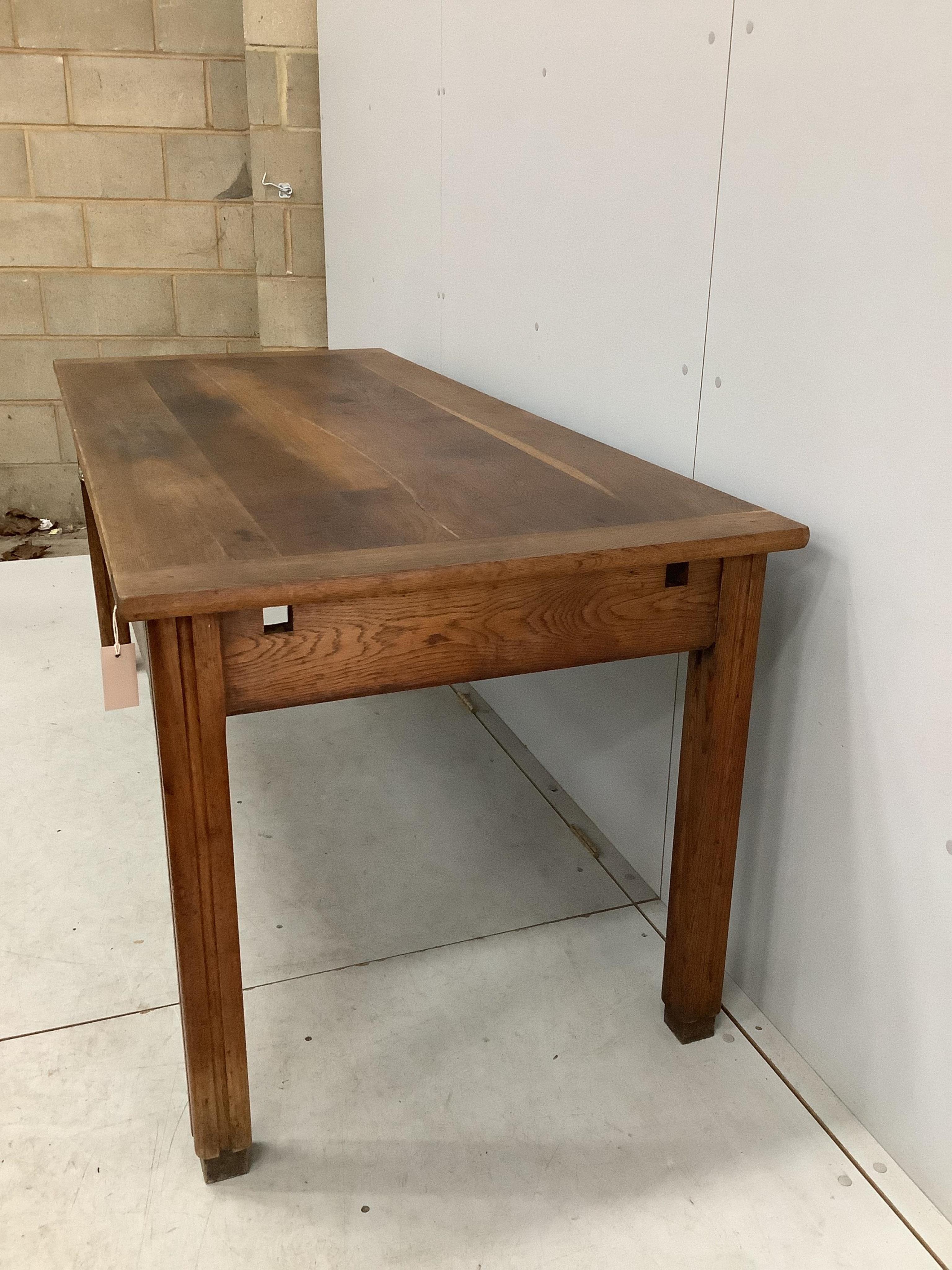 A French rectangular oak farmhouse kitchen table with detachable extension leaves and a single drawer, width 179cm, 277cm extended, depth 79cm, height 77cm. Condition - fair to good